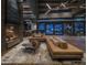 Spacious lobby area with a fireplace, comfortable seating, and stylish lighting fixtures at 12328 E Black Rock Rd, Scottsdale, AZ 85255