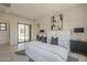 Spacious main bedroom with modern decor, bright natural light, and tile flooring at 12328 E Black Rock Rd, Scottsdale, AZ 85255