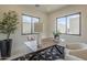 Well-lit home office with large windows, contemporary furniture, and a view of the outdoors at 12328 E Black Rock Rd, Scottsdale, AZ 85255