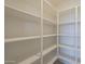 Spacious walk-in pantry featuring ample shelving for organized storage solutions at 12328 E Black Rock Rd, Scottsdale, AZ 85255