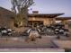 Stylish outdoor patio with cozy fire pits, comfortable seating, and serene desert landscape at 12328 E Black Rock Rd, Scottsdale, AZ 85255