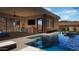 Inviting pool with integrated spa and outdoor kitchen, perfect for entertaining and enjoying sunny days at 12328 E Black Rock Rd, Scottsdale, AZ 85255