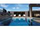 Relaxing pool area featuring lounge chairs and a tranquil waterfall feature, perfect for outdoor enjoyment at 12328 E Black Rock Rd, Scottsdale, AZ 85255