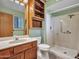 The bathroom features a step-in shower, wood cabinet, and large mirror at 12519 W Castle Rock Dr, Sun City West, AZ 85375