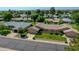 Beautiful single-story home showcasing mature landscaping, a well-manicured lawn, and a cozy front courtyard at 12519 W Castle Rock Dr, Sun City West, AZ 85375