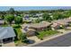 Lovely single-story home featuring solar panels, a well-manicured lawn, mature trees and charming desert landscaping at 12519 W Castle Rock Dr, Sun City West, AZ 85375