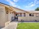 Inviting single-story home featuring a well-maintained front yard and charming brick accents at 12519 W Castle Rock Dr, Sun City West, AZ 85375