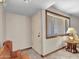 Bright room with neutral walls, tiled flooring, window, and a comfortable chair at 12519 W Castle Rock Dr, Sun City West, AZ 85375