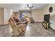 Spacious living area with tile flooring, comfortable furniture, and lots of natural light at 12519 W Castle Rock Dr, Sun City West, AZ 85375