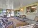 The enclosed patio features seating, side window, and sliding door entrance at 12519 W Castle Rock Dr, Sun City West, AZ 85375