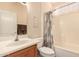 Cozy bathroom featuring a tub-shower combo with a shower curtain and a single sink vanity at 15074 W Cactus Ridge Way, Surprise, AZ 85374