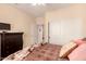 Bedroom features ample space with neutral paint, plush bed, and convenient closet and dresser providing storage at 15074 W Cactus Ridge Way, Surprise, AZ 85374