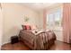 Comfortable bedroom offers natural light with a scenic view, plantation shutters, and ample space at 15074 W Cactus Ridge Way, Surprise, AZ 85374