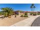Beautiful desert-landscaped home featuring drought-tolerant plants and a convenient two-car garage at 15074 W Cactus Ridge Way, Surprise, AZ 85374