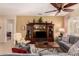 Well-appointed living room featuring a ceiling fan, stylish furniture, and neutral color palette at 15074 W Cactus Ridge Way, Surprise, AZ 85374