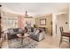 Warm and inviting living area with tile floors, comfortable sofas, and lots of natural light at 15074 W Cactus Ridge Way, Surprise, AZ 85374