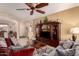 Spacious living room with couches, tile flooring and plenty of natural light at 15074 W Cactus Ridge Way, Surprise, AZ 85374