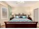 Comfortable main bedroom features soothing colors, dual nightstands and lamps, and a tranquil, relaxing atmosphere at 15074 W Cactus Ridge Way, Surprise, AZ 85374