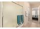 Bathroom shower with light surround, sliding door, and convenient towel bars provide a clean and accessible space at 15074 W Cactus Ridge Way, Surprise, AZ 85374