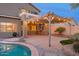 Backyard showcasing a private pool and outdoor kitchen with a covered patio, perfect for entertaining at 15123 W Custer Ln, Surprise, AZ 85379