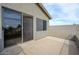 Outdoor balcony features stucco walls and patio door at 15123 W Custer Ln, Surprise, AZ 85379