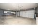 Spacious garage with built-in cabinets and plenty of room for parking and storage at 15123 W Custer Ln, Surprise, AZ 85379
