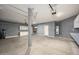 Garage featuring built-in storage cabinets and ample space for vehicles and projects at 15123 W Custer Ln, Surprise, AZ 85379