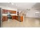 Well-appointed kitchen with wood cabinets, stainless steel appliances, granite countertops, and an open floor plan at 15123 W Custer Ln, Surprise, AZ 85379