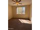 Bedroom providing a ceiling fan, window offering natural light, and plush carpet at 16013 S Desert Foothills Pkwy # 1050, Phoenix, AZ 85048