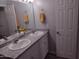 Bathroom features a double sink vanity and light gray walls at 1875 N St Francis Pl, Casa Grande, AZ 85122