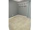 Bedroom featuring built in shelves, carpet floors, and neutral walls at 1875 N St Francis Pl, Casa Grande, AZ 85122