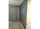 Bedroom featuring grey walls, carpet floors, and a closet with grey curtains at 1875 N St Francis Pl, Casa Grande, AZ 85122
