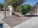 Landscaped front yard showcasing desert foliage and a two-car garage at 1875 N St Francis Pl, Casa Grande, AZ 85122