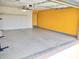 Spacious garage with painted walls, ample storage space, and a convenient interior access door at 1875 N St Francis Pl, Casa Grande, AZ 85122