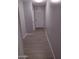 Hallway with durable wood flooring, neutral paint, and access to multiple rooms at 1875 N St Francis Pl, Casa Grande, AZ 85122