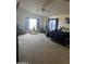 A large main bedroom with a seating area and carpeted flooring at 19427 N Toya St, Maricopa, AZ 85138