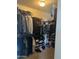 A walk-in closet filled with clothing and shoes at 19427 N Toya St, Maricopa, AZ 85138