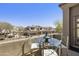 Relaxing balcony with serene views and a glass patio table at 19475 N Grayhawk Dr # 2132, Scottsdale, AZ 85255
