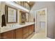 Bathroom featuring dual sinks, wooden cabinets, and generous vanity space at 19475 N Grayhawk Dr # 2132, Scottsdale, AZ 85255