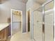 Bathroom featuring a glass-enclosed shower and a walk-in closet with ample storage space at 19475 N Grayhawk Dr # 2132, Scottsdale, AZ 85255