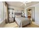 Comfortable bedroom featuring designer decor and a ceiling fan at 19475 N Grayhawk Dr # 2132, Scottsdale, AZ 85255