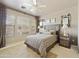 Bedroom featuring a ceiling fan and large windows for natural light at 19475 N Grayhawk Dr # 2132, Scottsdale, AZ 85255
