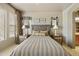 Cozy bedroom with ceiling fan, ornate headboard, and unique decor at 19475 N Grayhawk Dr # 2132, Scottsdale, AZ 85255