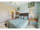 Well-lit bedroom features a ceiling fan and easy access to the walk-in closet at 19475 N Grayhawk Dr # 2132, Scottsdale, AZ 85255