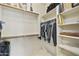 Spacious walk-in closet featuring shelves and hanging rods for organization at 19475 N Grayhawk Dr # 2132, Scottsdale, AZ 85255
