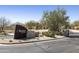 Elegant community entrance featuring mature landscaping and monument signage at 19475 N Grayhawk Dr # 2132, Scottsdale, AZ 85255
