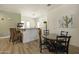 Inviting community kitchen area featuring a round table, bar seating and appliances at 19475 N Grayhawk Dr # 2132, Scottsdale, AZ 85255