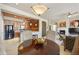 Open dining room showcasing seamless flow to kitchen, fireplace, and living area, great for entertaining at 19475 N Grayhawk Dr # 2132, Scottsdale, AZ 85255