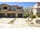 Inviting townhouse exterior with a private garage, neutral colors, and well-maintained landscaping at 19475 N Grayhawk Dr # 2132, Scottsdale, AZ 85255