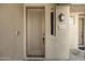 Close up of the front door featuring a craftsman style door, lantern fixture, and address plaque at 19475 N Grayhawk Dr # 2132, Scottsdale, AZ 85255